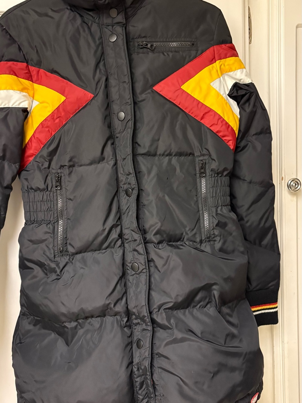 Women's Black Puffer Coat with Red, Yellow & White Chevron Accents